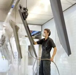 Powder coating by hand at Jud GmbH & Co. KG